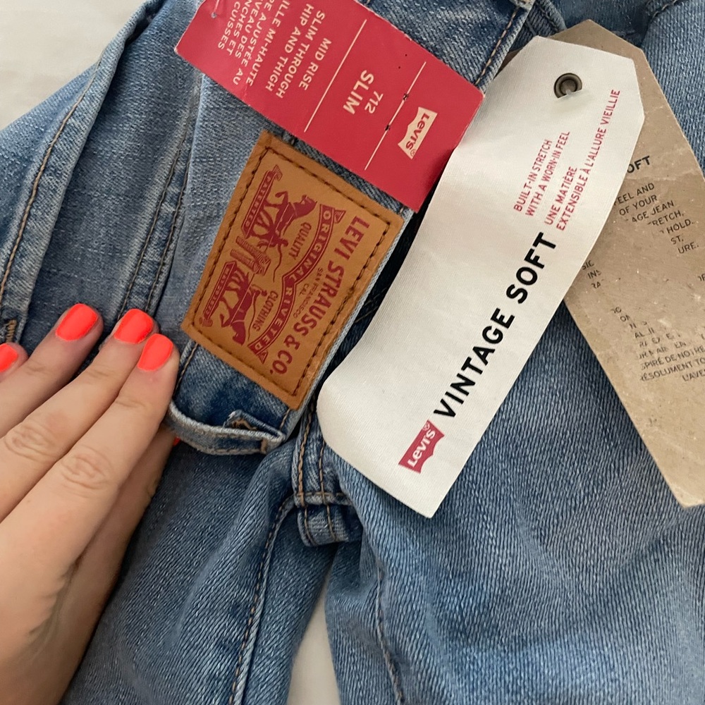 Levi’s jeans new mid rise, slim through hip and thigh